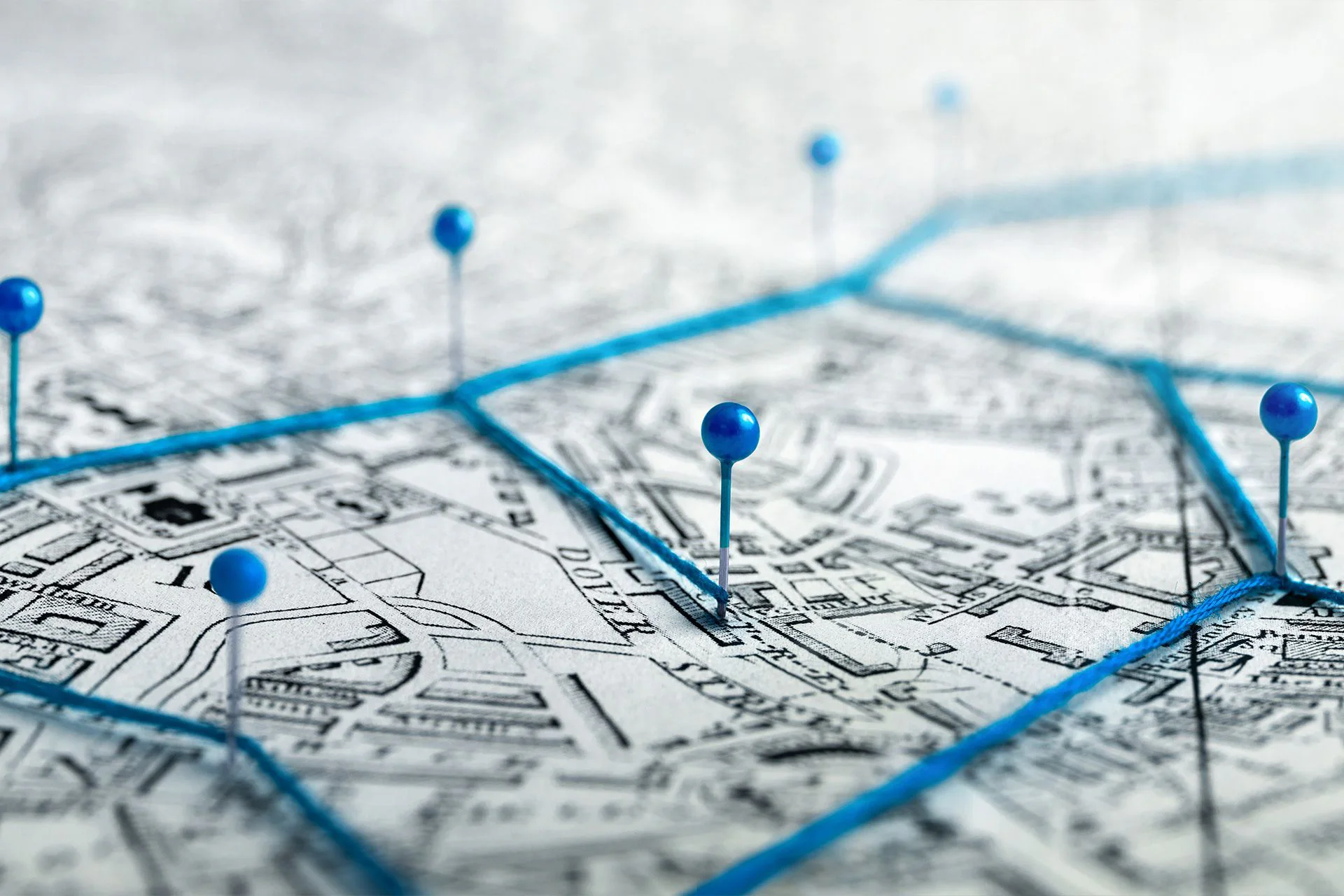 Street map with blue pins marking service locations